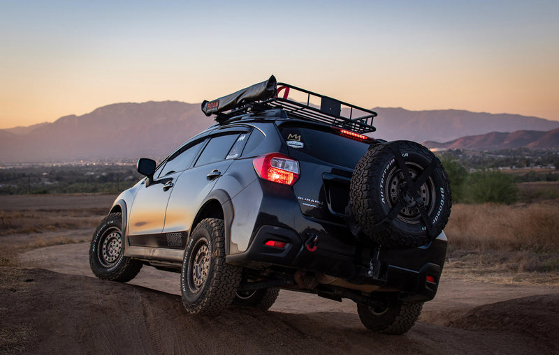 Load image into Gallery viewer, Rooftop awning attached to roof rails of a Subaru Crosstrek
