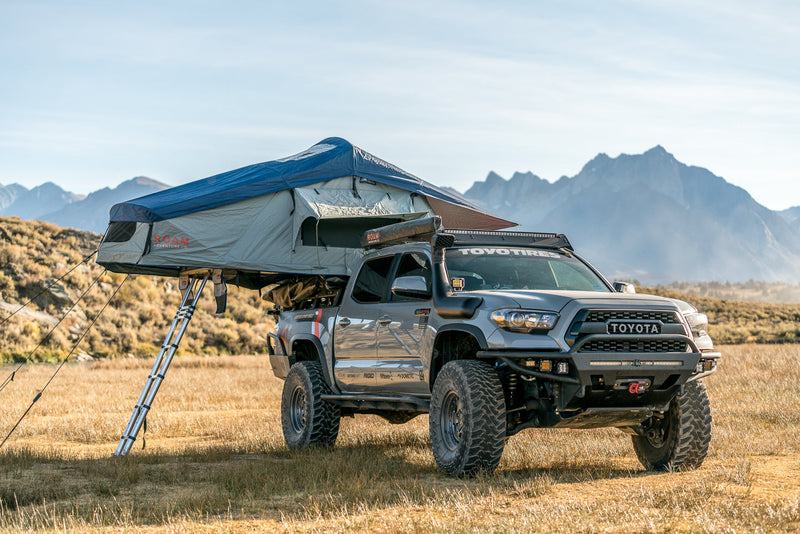 Load image into Gallery viewer, Vagabond Rooftop Tent in Slate Grey Navy Blue shown on Toyota Tacoma
