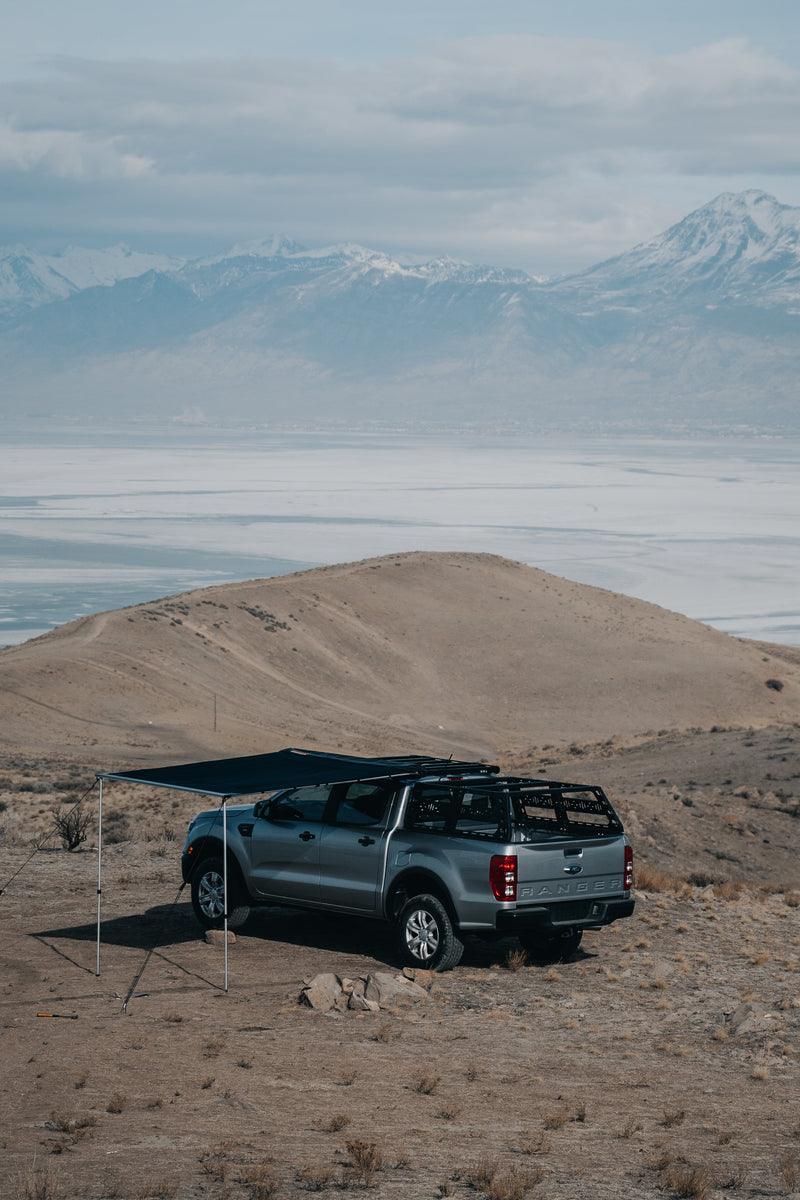 Load image into Gallery viewer, ROAM Adventure Co. Rooftop Awning in black shown on a Ford Ranger
